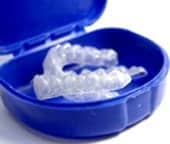 Photo of teeth whitening trays in a blue case; for information on dark stains in teeth from Naperville cosmetic dentist Dr. David Newkirk.